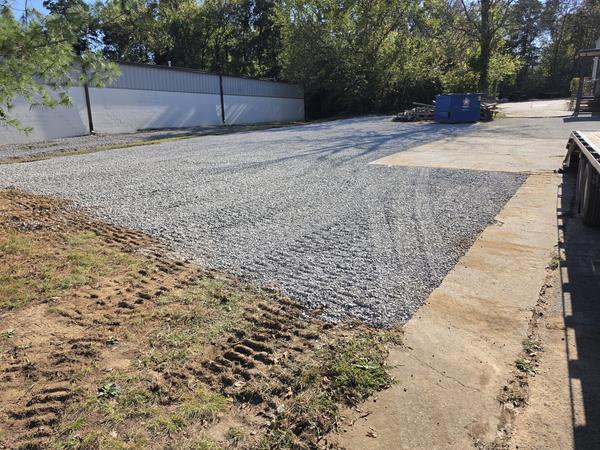 After: finished gravel lot seen from the far corner