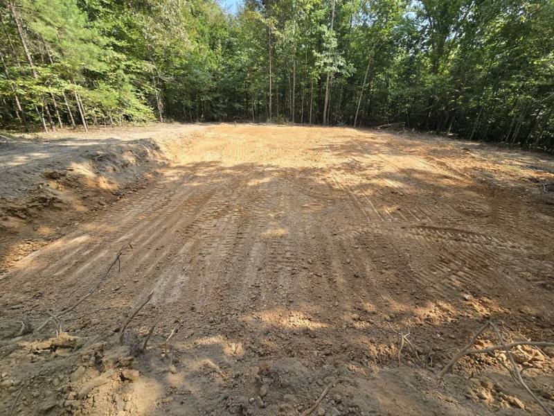 Cleared wooded area graded for a building pad